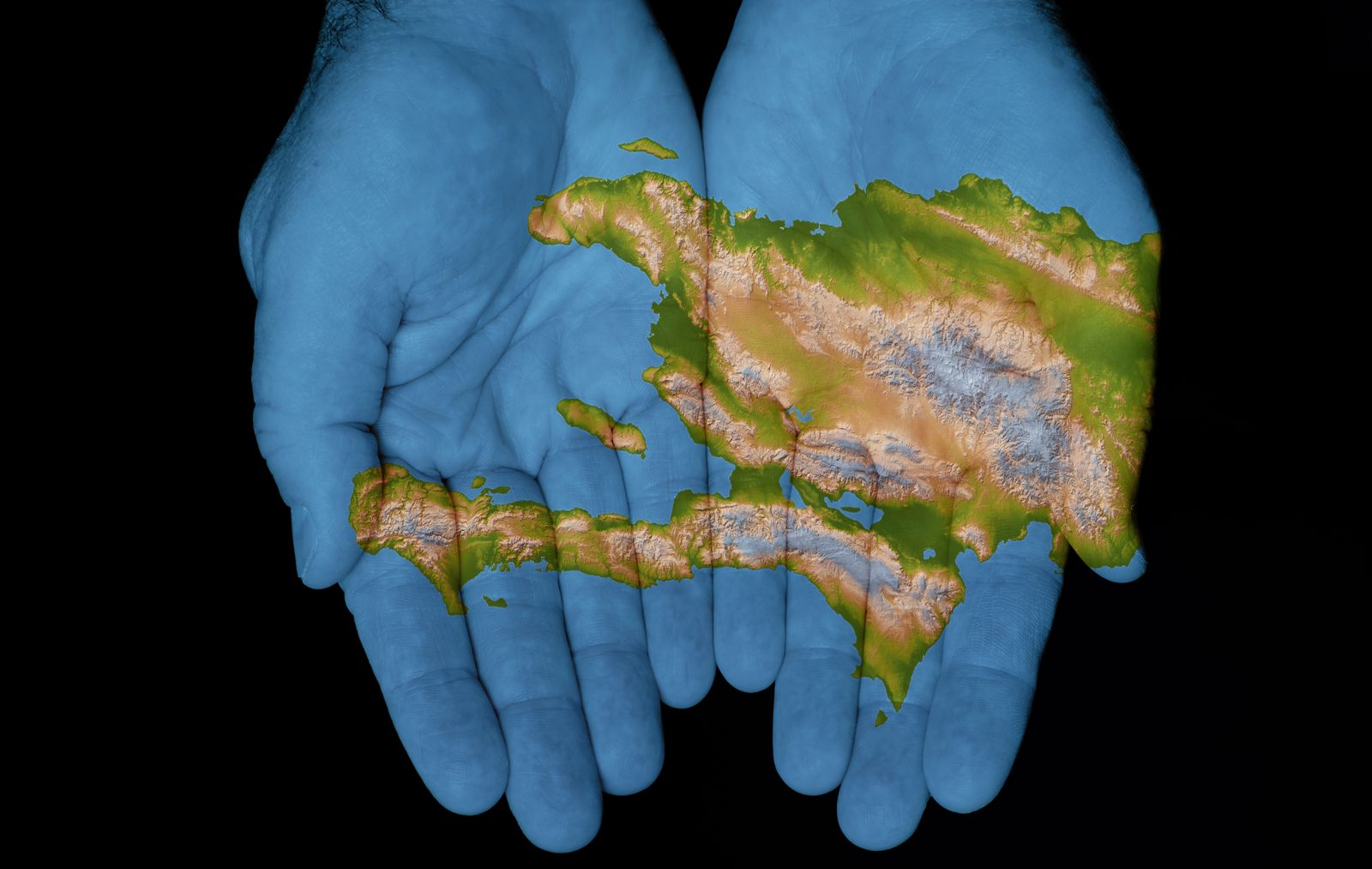 Haiti's map held in open hands — the future of Haiti is in our hands